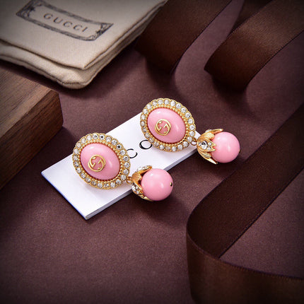GUCCI 26S GG PINK ENAMEL HALO CRYSTAL DROP EARRINGS IN GOLD TONE METAL 624259