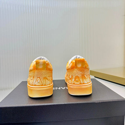 CHANEL 26S LOW-TOP SNEAKERS IN GOLDEN ORANGE CALFSKIN