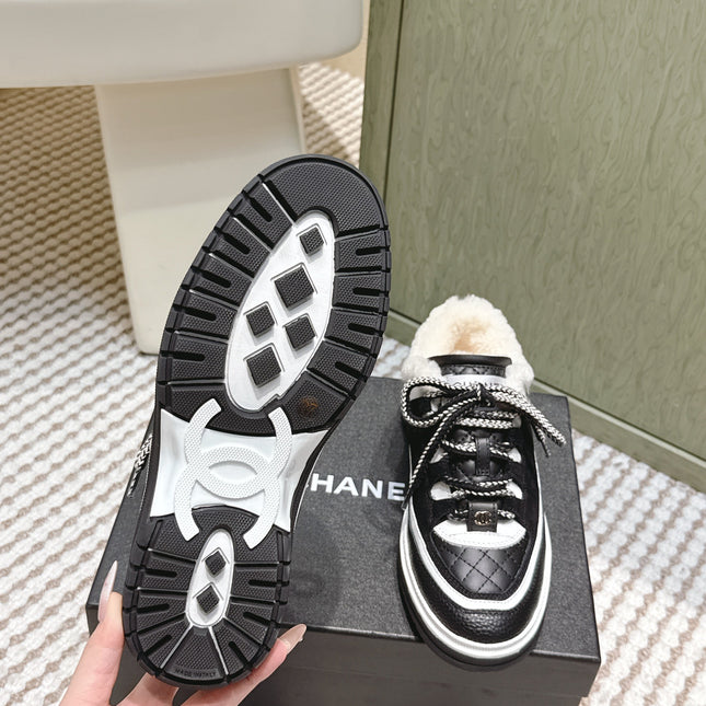CHANEL 25S THICK-SOLE SNEAKERS IN BLACK AND WHITE CALFSKIN WITH FUR LINING
