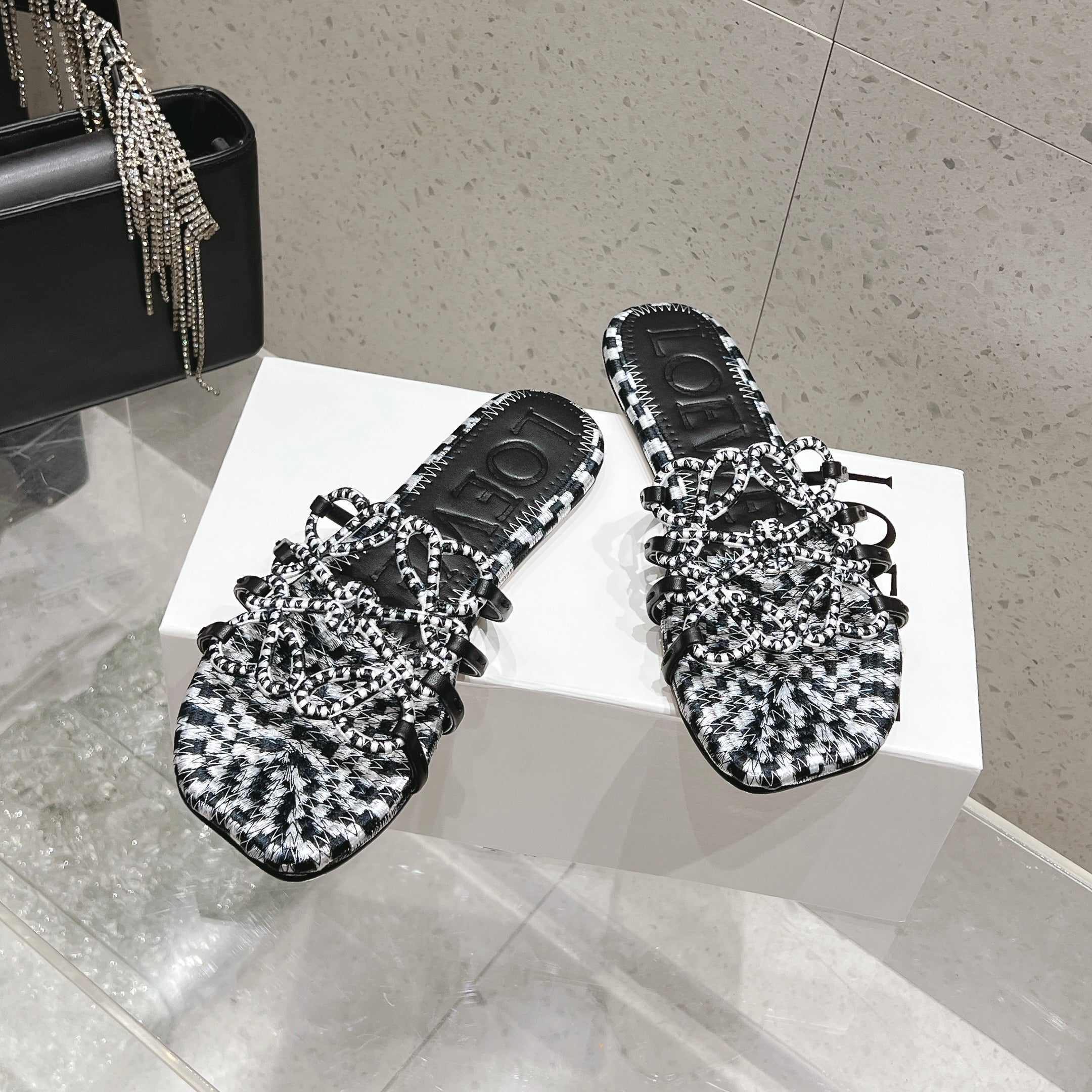 LOEWE 26S BRAIDED CAGE SLIDE SANDALS IN BLACK AND WHITE CALFSKIN
