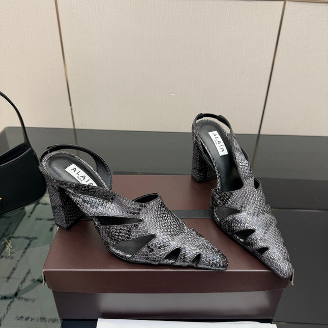 ALAIA 26S HEELED SLINGBACKS IN BLACK PYTHON-EMBOSSED LEATHER