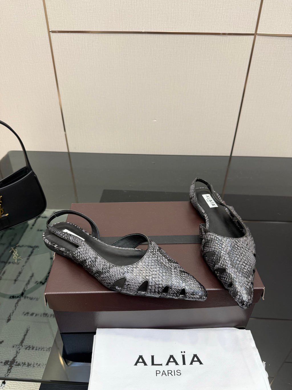 ALAIA 26S CUT-OUT SLINGBACK FLATS IN BLACK PYTHON-EMBOSSED LEATHER
