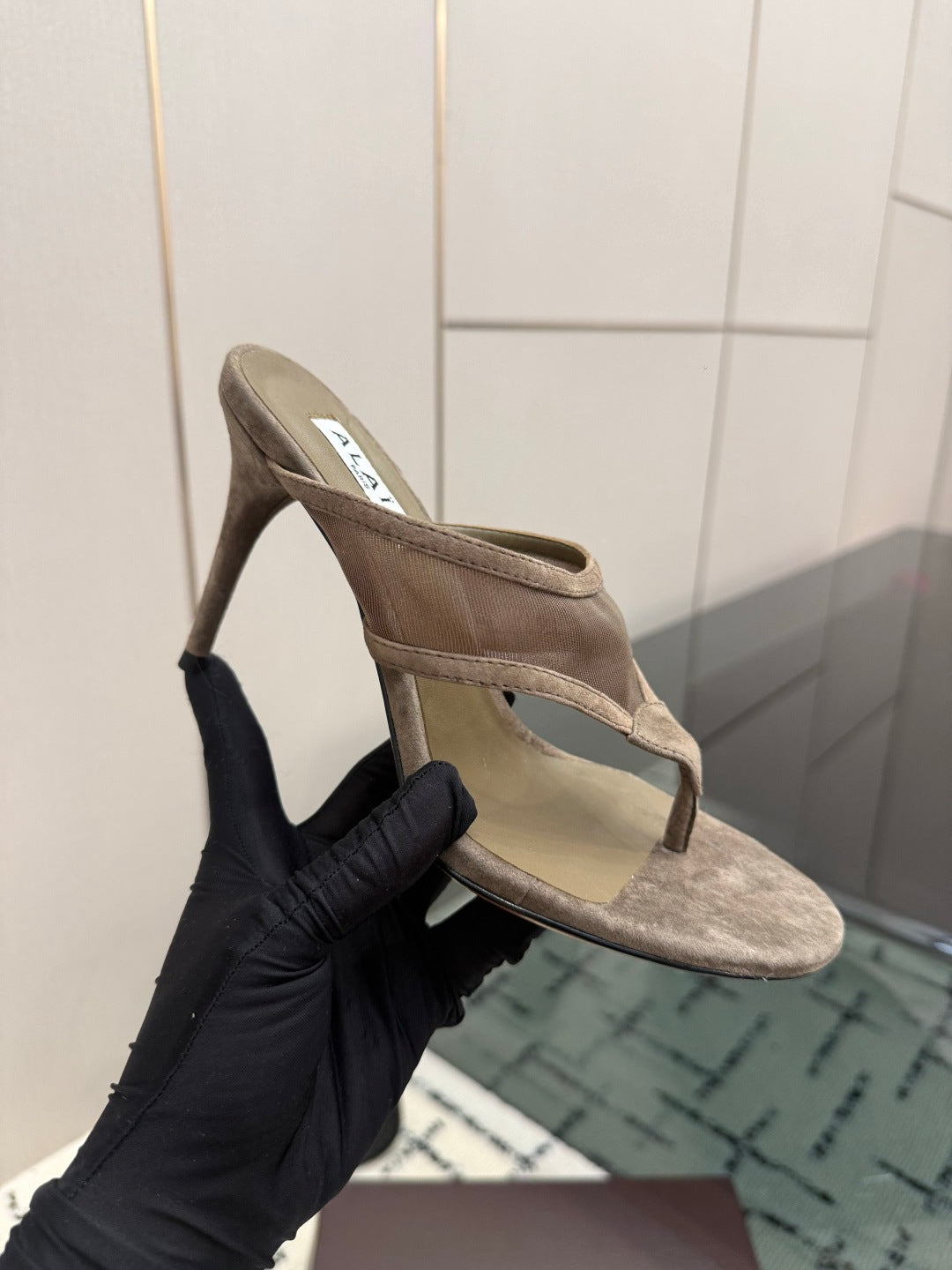 ALAIA 26S HEELED THONG MULE SANDALS IN TAUPE SUEDE