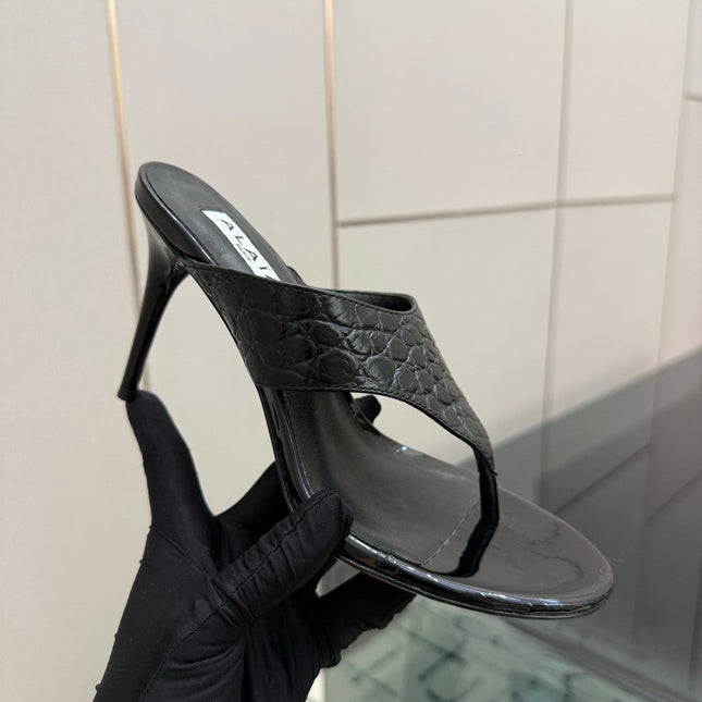 ALAIA 26S HEELED THONG MULE SANDALS IN BLACK CALFSKIN