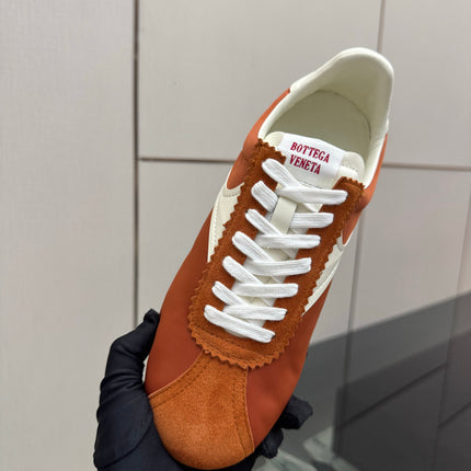 BOTTEGA VENETA 26S LOW TOP SNEAKERS IN BRICK ORANGE FABRIC AND SUEDE