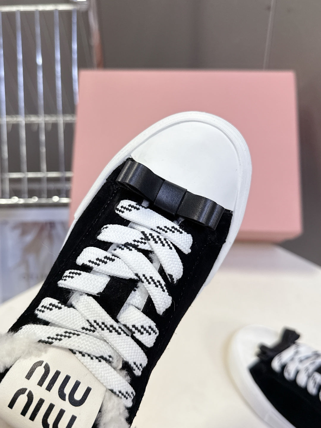 MIUMIU 25S SNEAKERS IN BLACK SUEDE WITH SHEARLING