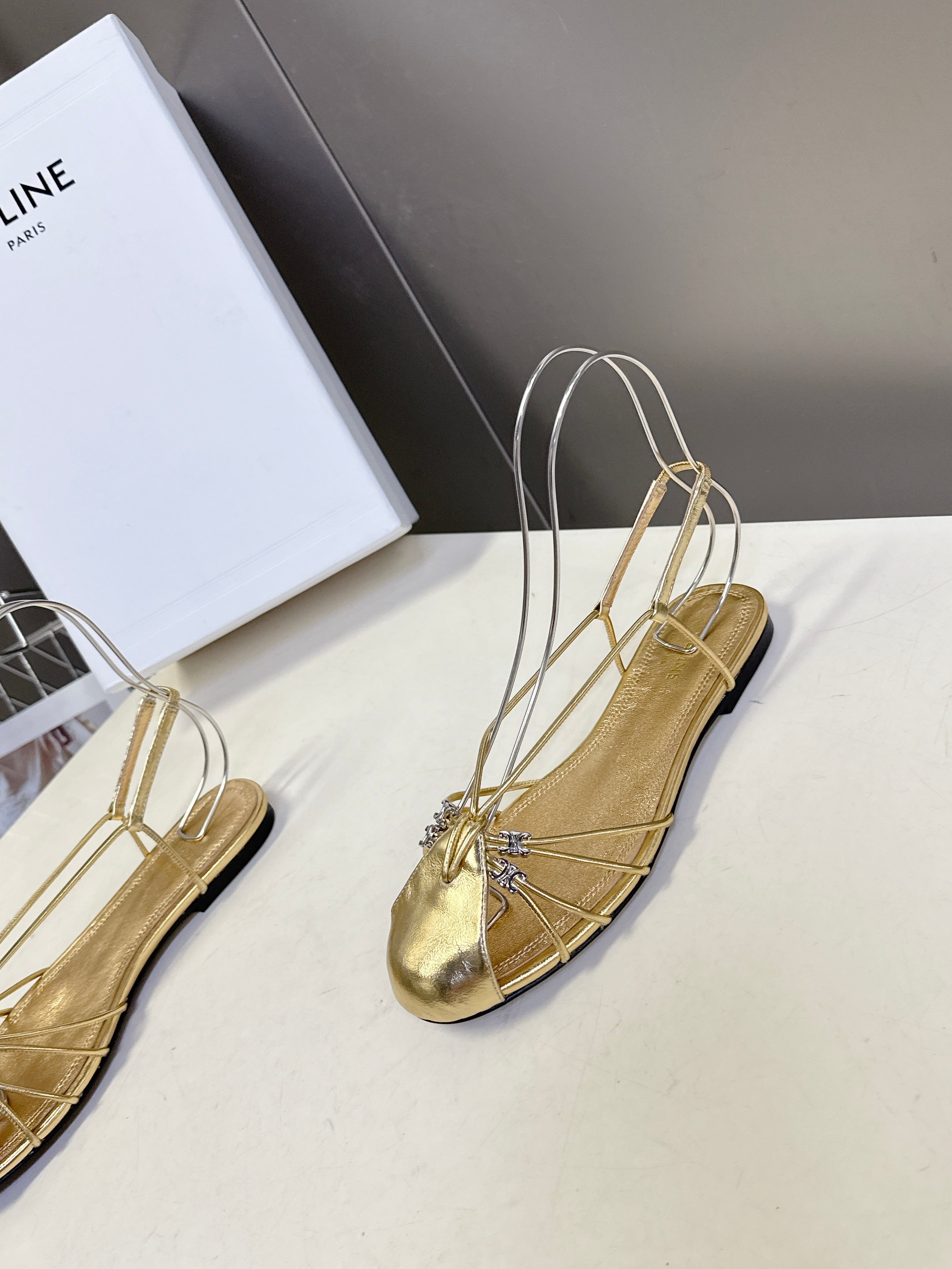 CELINE 26S TRIOMPHE LACE UP ANKLE STRAP FLAT SANDALS IN GOLD CALFSKIN
