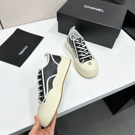 CHANEL 26S PLATFORM SNEAKERS IN BLACK AND WHITE CALFSKIN