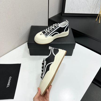 CHANEL 26S PLATFORM SNEAKERS IN BLACK AND WHITE CALFSKIN