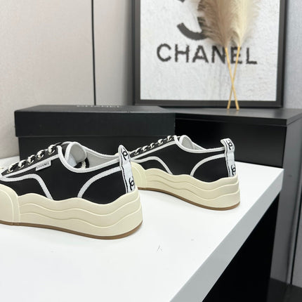 CHANEL 26S PLATFORM SNEAKERS IN BLACK AND WHITE CALFSKIN