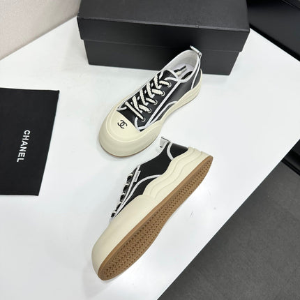 CHANEL 26S PLATFORM SNEAKERS IN BLACK AND WHITE CALFSKIN