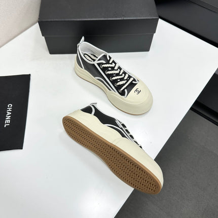 CHANEL 26S PLATFORM SNEAKERS IN BLACK AND WHITE CALFSKIN