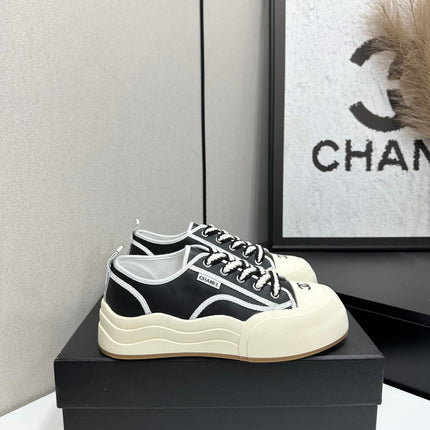 CHANEL 26S PLATFORM SNEAKERS IN BLACK AND WHITE CALFSKIN