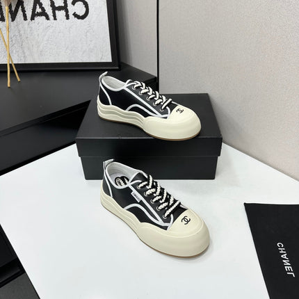 CHANEL 26S PLATFORM SNEAKERS IN BLACK AND WHITE CALFSKIN
