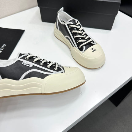 CHANEL 26S PLATFORM SNEAKERS IN BLACK AND WHITE CALFSKIN