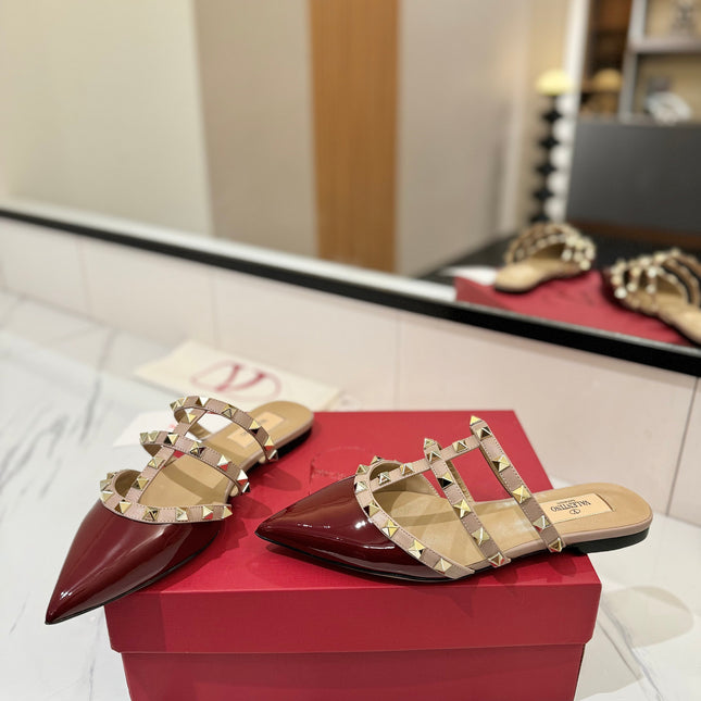 VALENTINO 26S STUDDED FLAT MULES IN DARK RED PATENT CALFSKIN