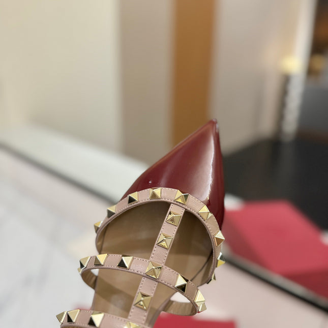 VALENTINO 26S STUDDED FLAT MULES IN DARK RED PATENT CALFSKIN
