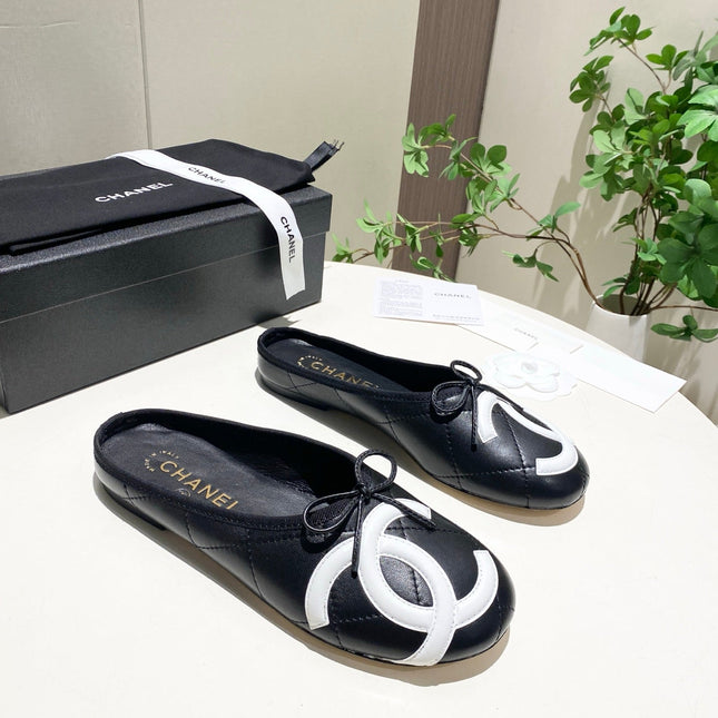 CHANEL 26S FLAT MULES IN BLACK LAMBSKIN