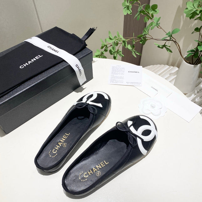 CHANEL 26S FLAT MULES IN BLACK LAMBSKIN