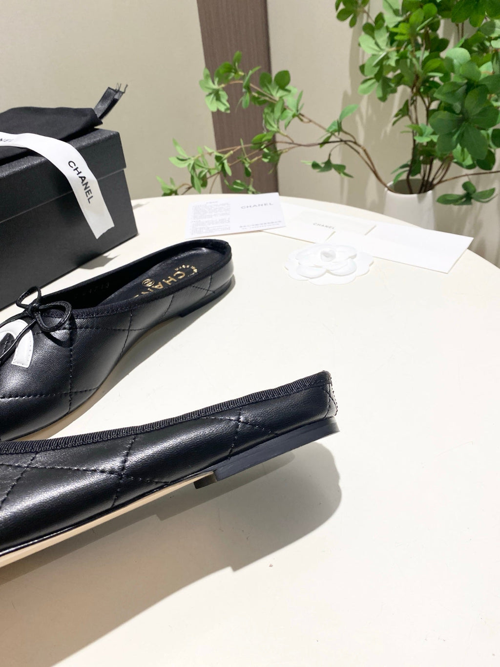 CHANEL 26S FLAT MULES IN BLACK LAMBSKIN