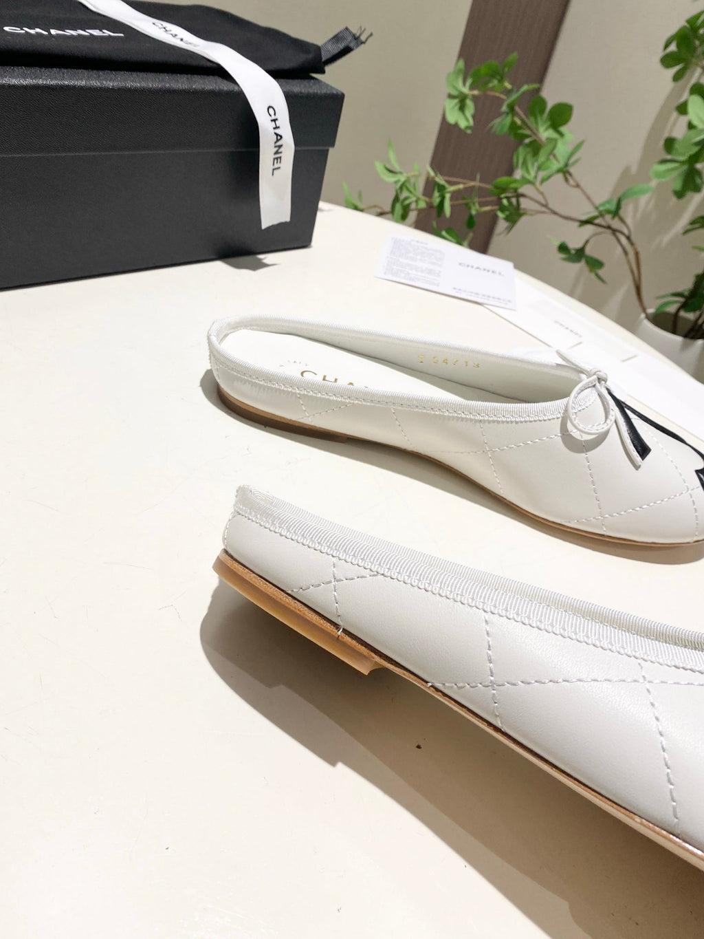CHANEL 26S FLAT MULES IN WHITE LAMBSKIN