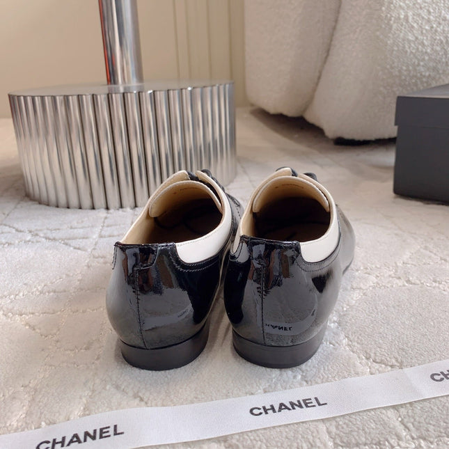 CHANEL 25S TWO TONE LACE UP IN BLACK AND WHITE SHINY CALFSKIN
