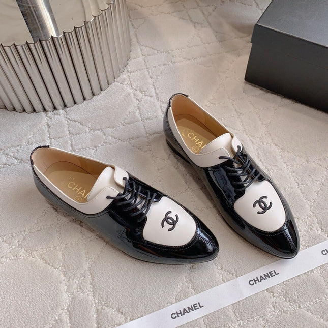 CHANEL 25S TWO TONE LACE UP IN BLACK AND WHITE SHINY CALFSKIN