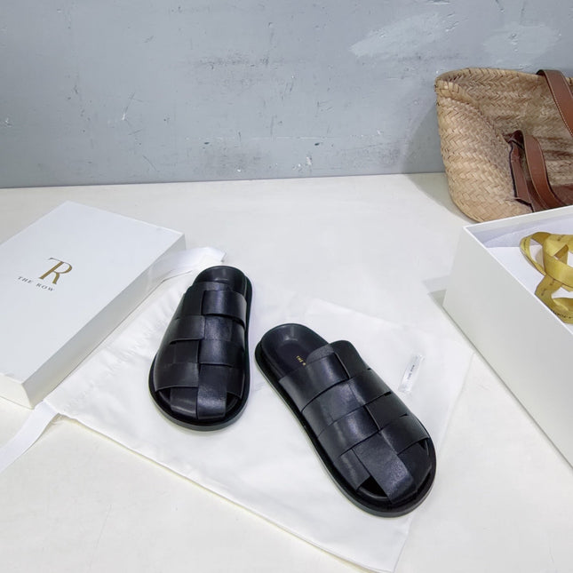 THE ROW 26S CAGE SLIDES IN BLACK SMOOTH CALFSKIN