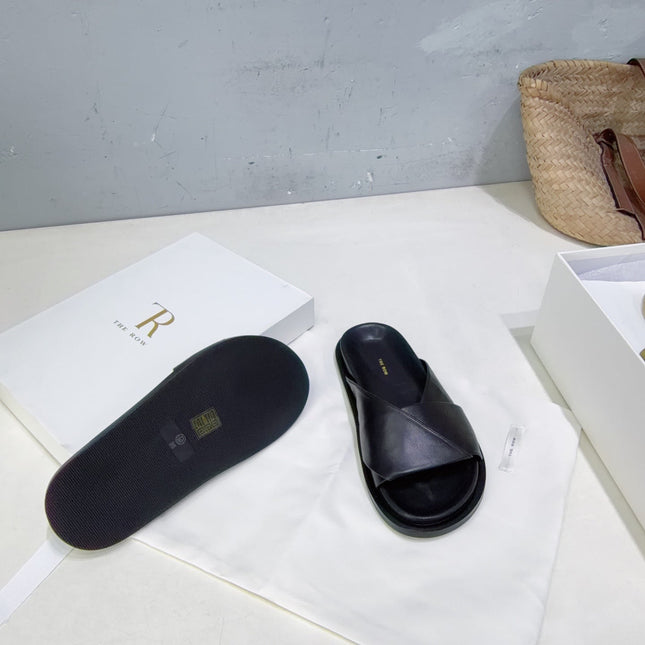 THE ROW 26S CROSS STRAP SLIDES IN BLACK CALFSKIN