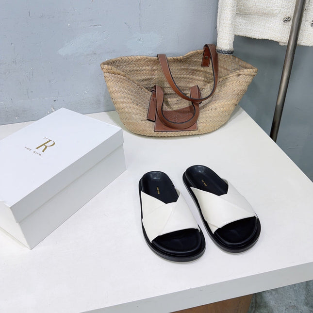 THE ROW 26S CROSS STRAP SLIDES IN IVORY WHITE CALFSKIN WITH BLACK FOOTBED
