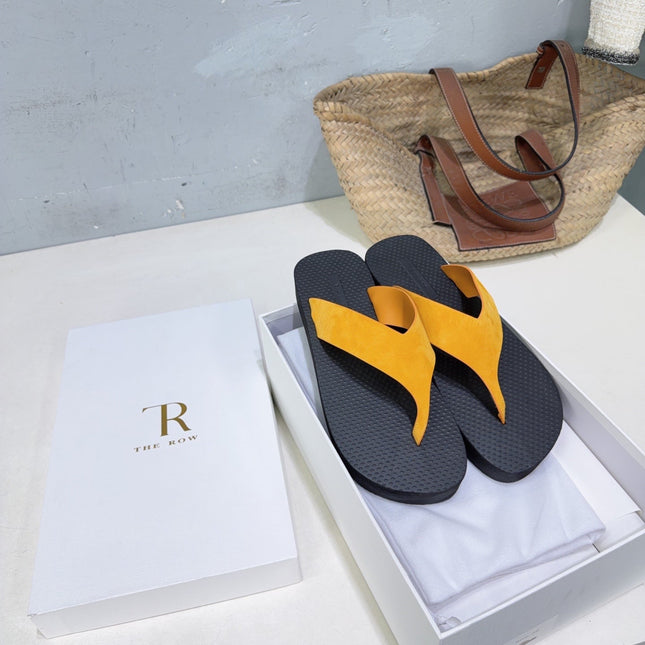 THE ROW 26S THONG SANDALS IN BLACK RUBBER  WITH GOLD YELLOW STRAPS