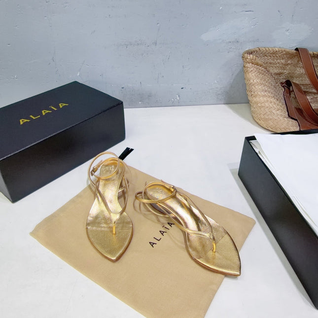 ALAIA 26S THONG SANDALS IN GOLD CALFSKIN