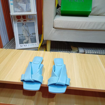 BOTTEGA VENETA 26S FLAT SLIDES IN SKY BLUE LAMBSKIN