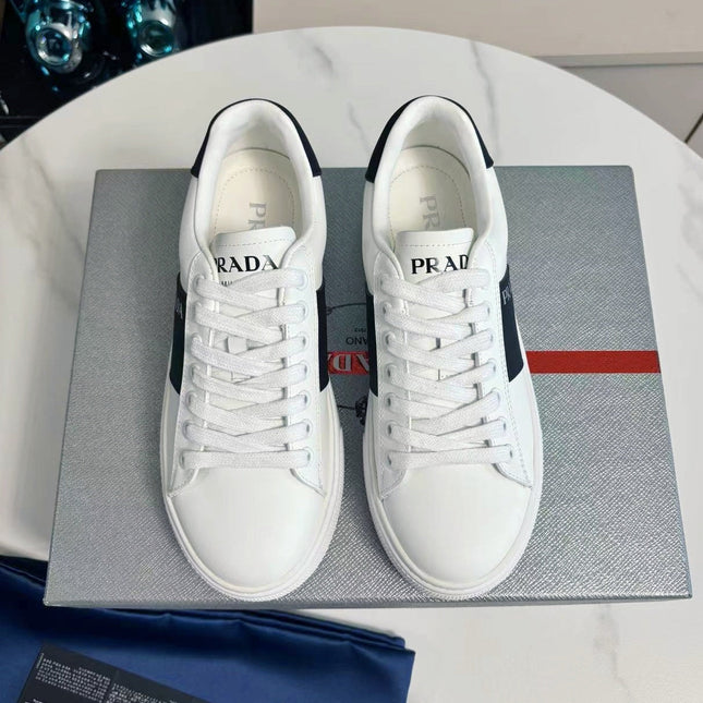 PRADA 25S LEATHER LOGO OUTLET SNEAKERS BLACK AND WHITE CALFSKIN