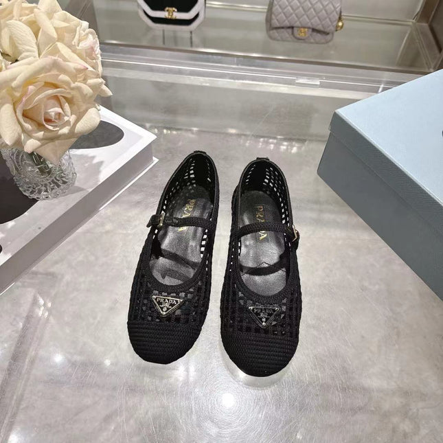 PRADA 26S LOGO PLAQUE MARY JANE FLATS IN BLACK WOVEN FIBER