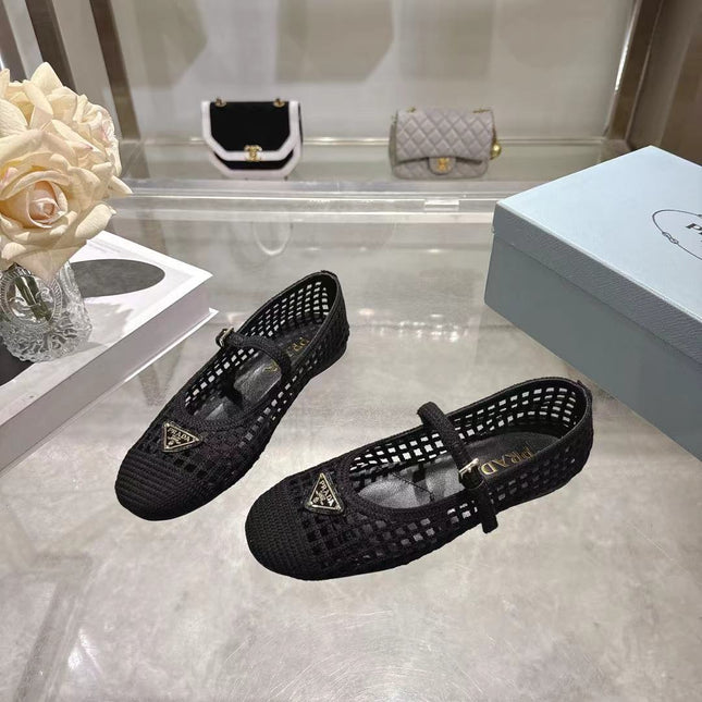 PRADA 26S LOGO PLAQUE MARY JANE FLATS IN BLACK WOVEN FIBER