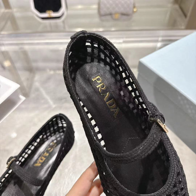 PRADA 26S LOGO PLAQUE MARY JANE FLATS IN BLACK WOVEN FIBER