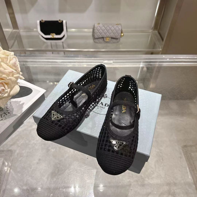 PRADA 26S LOGO PLAQUE MARY JANE FLATS IN BLACK WOVEN FIBER