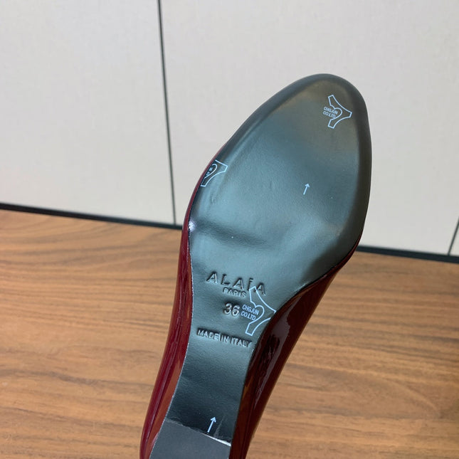 ALAIA 26S WEDGE MULES 70 MM IN DARK RED GLOSSY CALFSKIN
