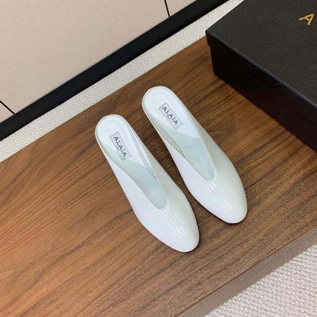 ALAIA 26S WEDGE MULES 70 MM IN WHITE GLOSSY CALFSKIN