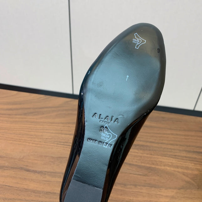 ALAIA 26S WEDGE MULES 70 MM IN BLACK GLOSSY CALFSKIN