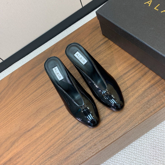 ALAIA 26S WEDGE MULES 70 MM IN BLACK GLOSSY CALFSKIN