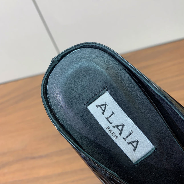 ALAIA 26S WEDGE MULES 70 MM IN BLACK GLOSSY CALFSKIN
