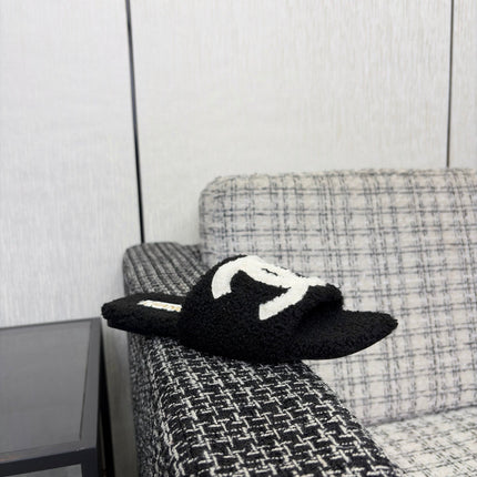 CHANEL 26S SLIDE SANDALS IN BLACK SHEARLING AND WHITE CC LOGO SQUARE TOE