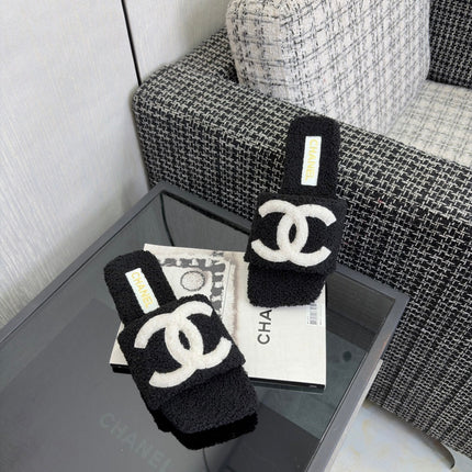 CHANEL 26S SLIDE SANDALS IN BLACK SHEARLING AND WHITE CC LOGO SQUARE TOE