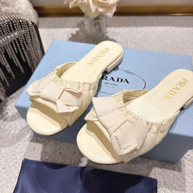 PRADA 26S RUCHED BOW SLIDE SANDALS IN IVORY WHITE CALFSKIN