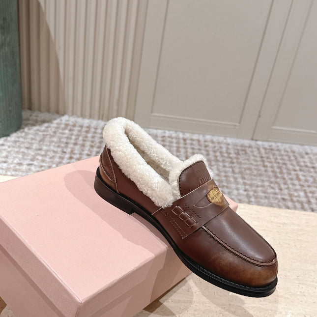 MIUMIU 25S PENNY LOAFERS 20MM IN EBONY BROWN BLEACHED CALFSKIN WITH SHEARLING