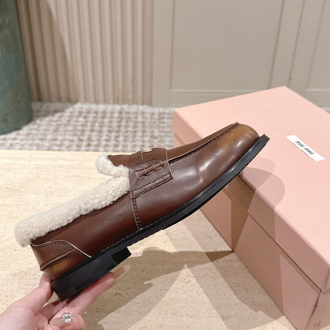 MIUMIU 25S PENNY LOAFERS 20MM IN EBONY BROWN BLEACHED CALFSKIN WITH SHEARLING