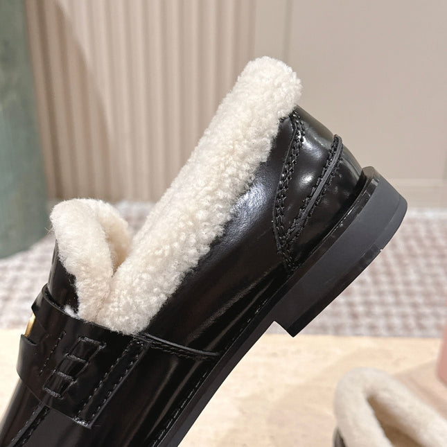 MIUMIU 25S PENNY LOAFERS 20MM IN BLACK PATENT CALFSKIN WITH SHEARLING