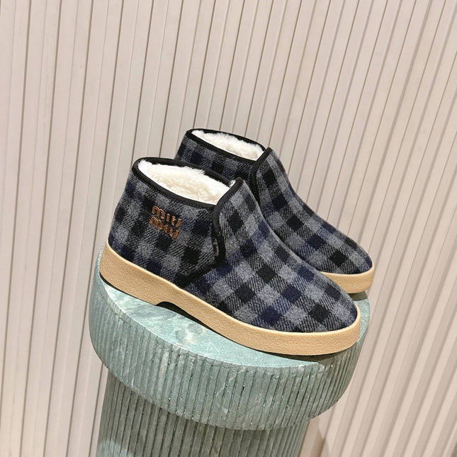 MIUMIU 25S SLIP-ON BOOTIES IN BLACK AND BLUE WOOL WITH SHEARLING
